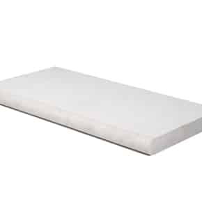 Close-up of Moleanos sawn pool copings with a sandblasted texture