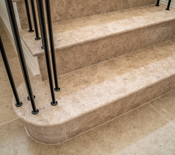 La Roche limestone brushed and honed staircase showing bottom curved blocks and step 2 ws