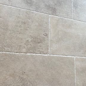 Close-up of natural limestone floor tiles in the Amphilly French collection