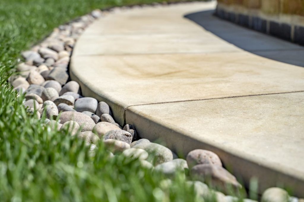 Yellow Mint curved paving near grass