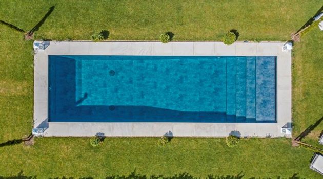 overhead shot of white mint sandpasted pool copings ws