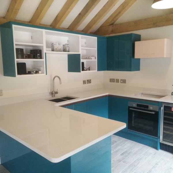 Summit stone crystal White worktops on blue kitchen